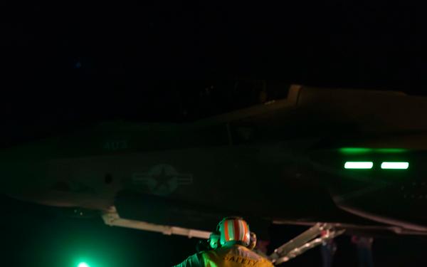 A Sailor Prepares to Launch a F-35C Lightning II aboard Nimitz-class aircraft carrier USS Carl Vinson (CVN 70)